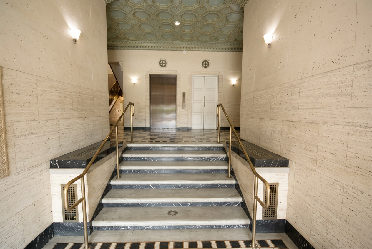 Marble staircase and brass handrails in the building lobby